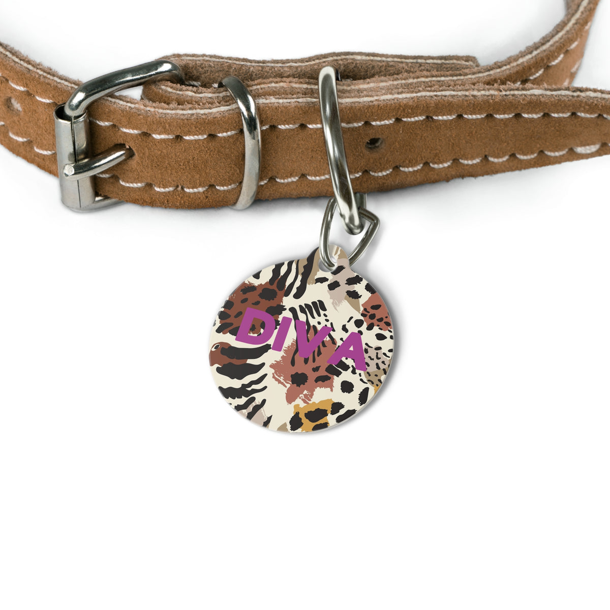 Safari print name tag attached to a tan leather dog collar