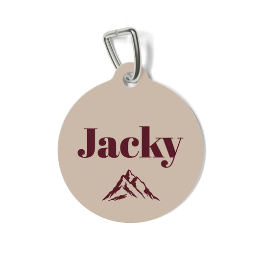 Personalized sand-toned pet tag with mountain motif and dog's name, main design shot