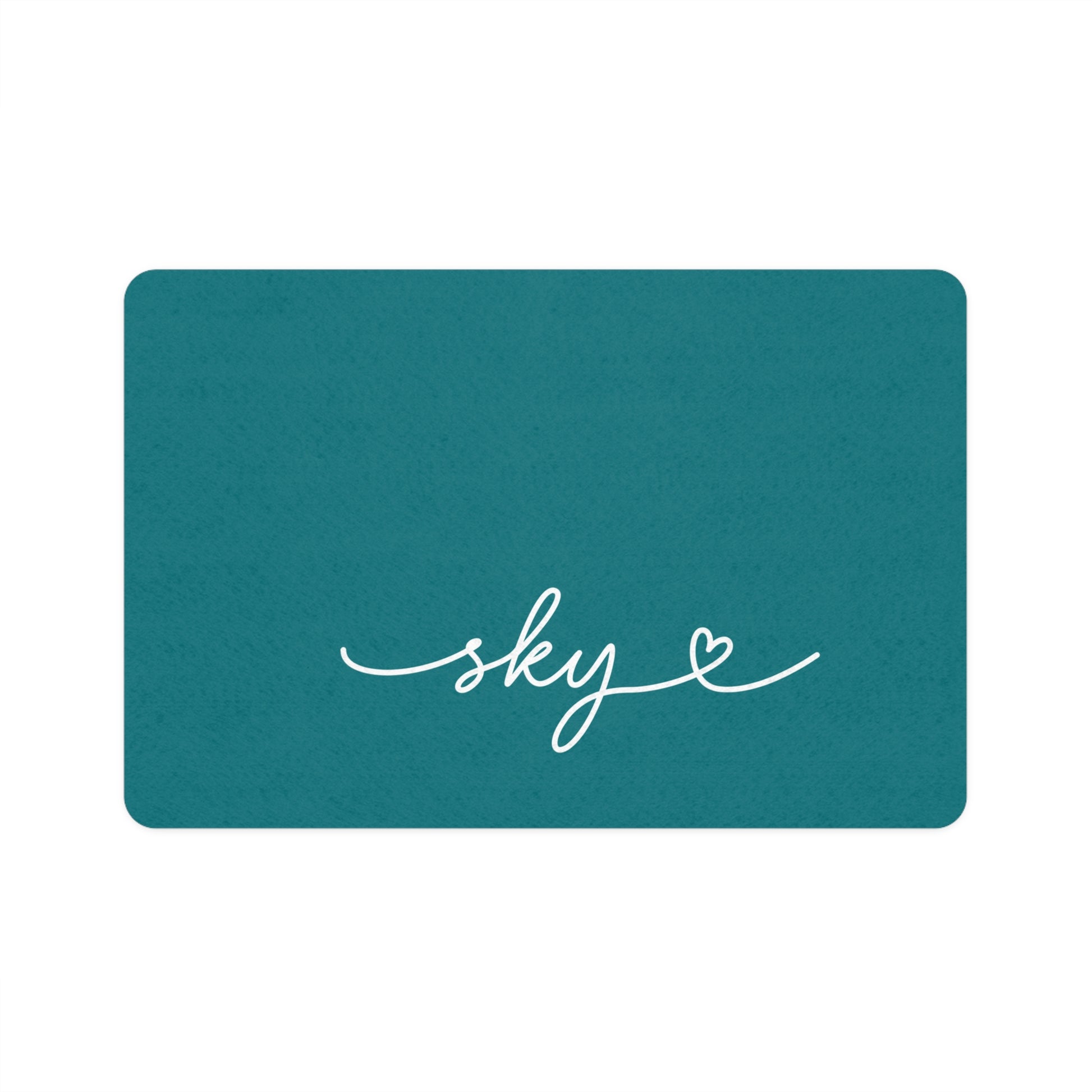 Personalized teal dog food mat with pet name in handwritten script