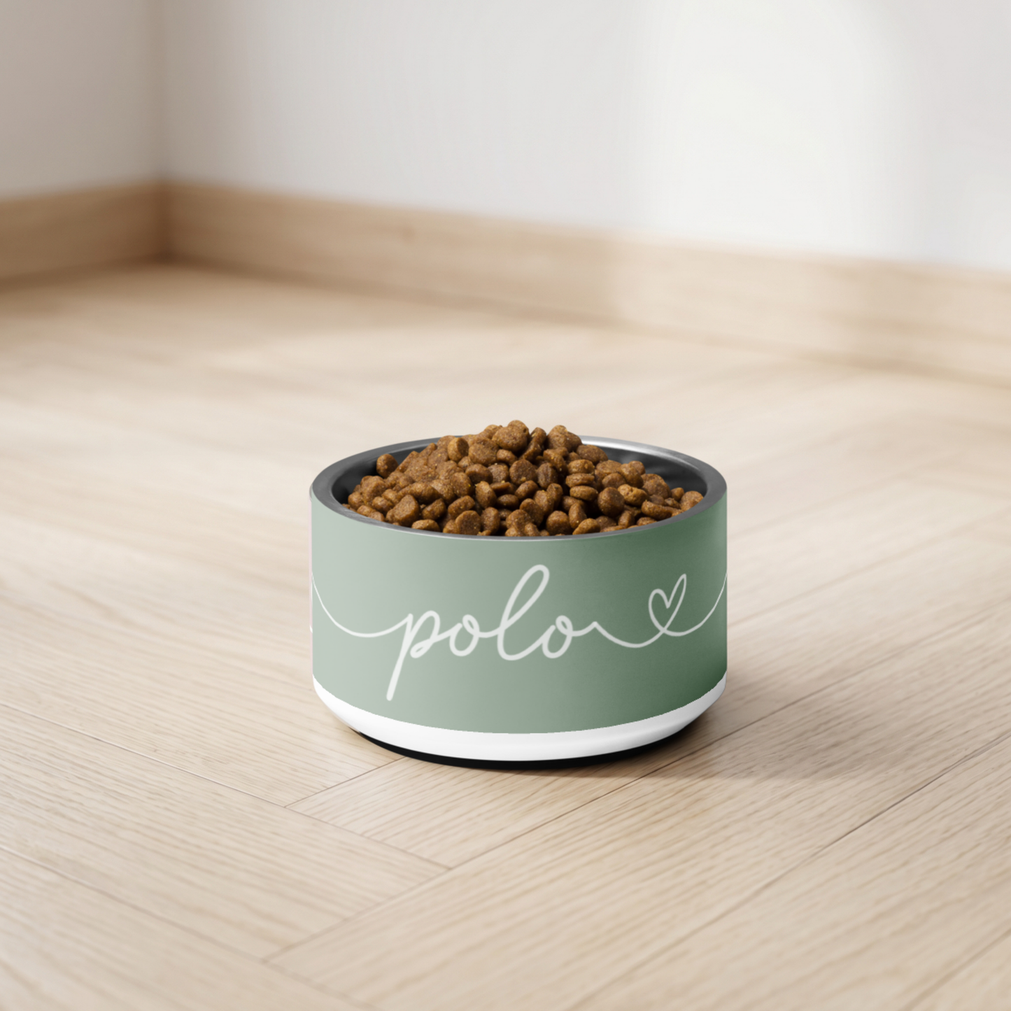 Personalized thyme green dog bowl with kibble on the floor - close-up lifestyle shot