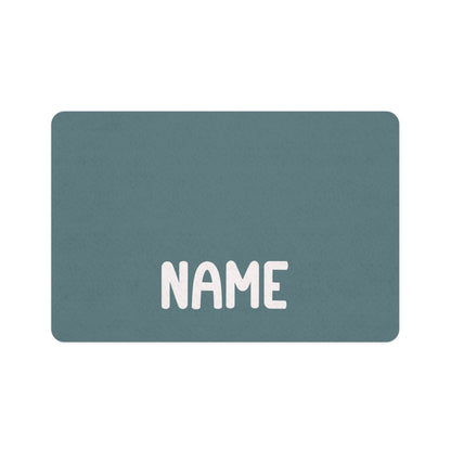 Petrol blue rectangle personalized pet food mat with a name in bold white lettering