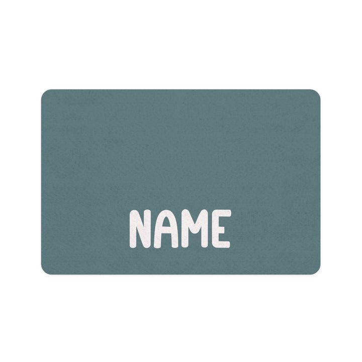 Petrol blue rectangle personalized pet food mat with a name in bold white lettering