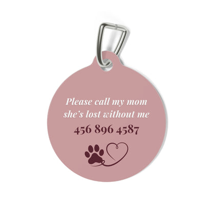 Back of the pink heart pet tag with phone number and paw heart