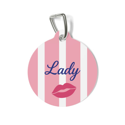 Pink and white striped personalized pet tag with a name in navy script and red lips