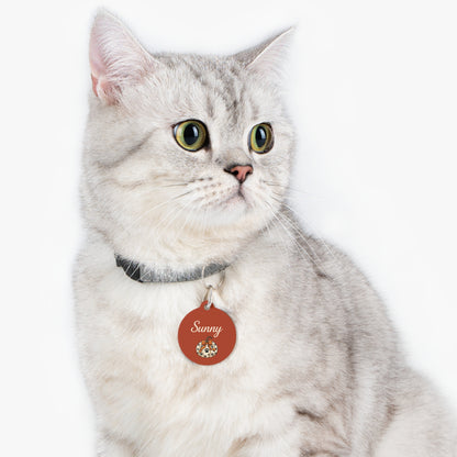 Cat wearing a rust pumpkin personalized pet ID tag
