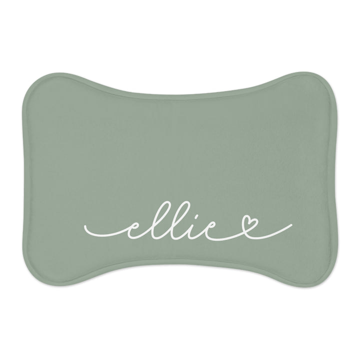 Sage green bone-shaped personalized pet feeding mat with the name Ellie in white handwritten script and a small heart