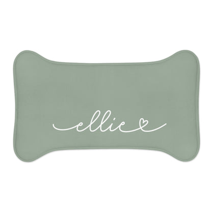 Large sage green bone-shaped personalized pet feeding mat with a white script name