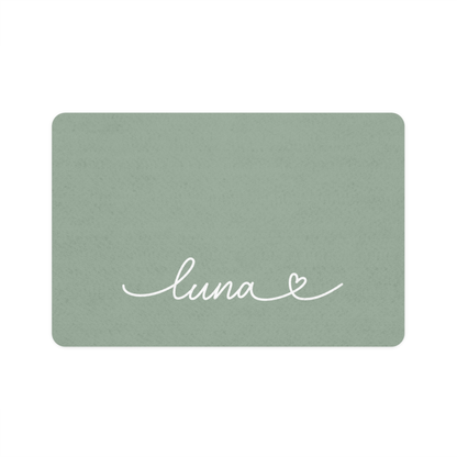 Sage green rectangle personalized pet food mat with the name Luna in white handwritten script and a small heart
