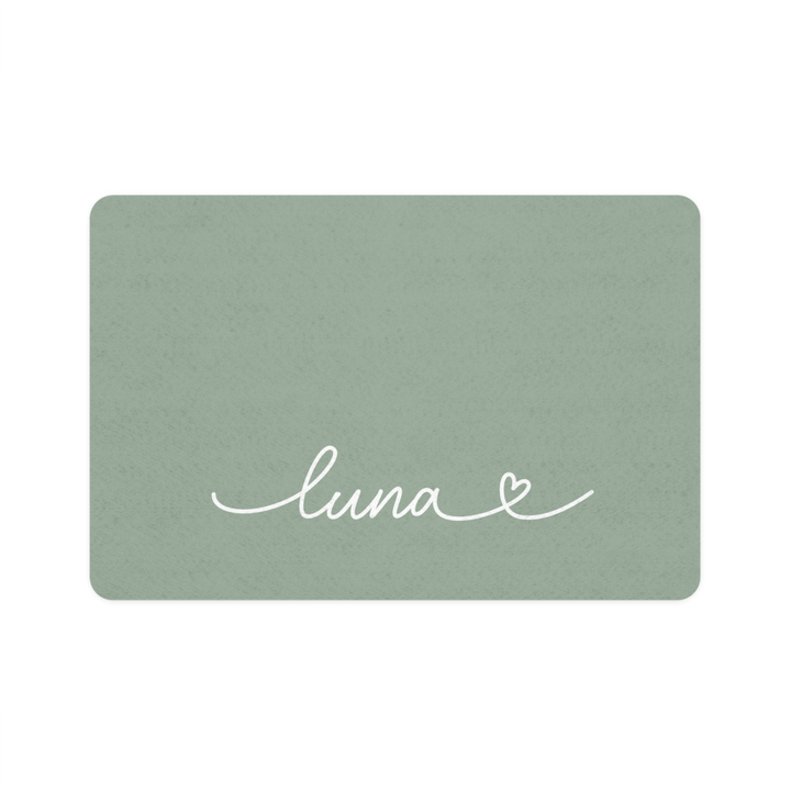 Sage green rectangle personalized pet food mat with the name Luna in white handwritten script and a small heart