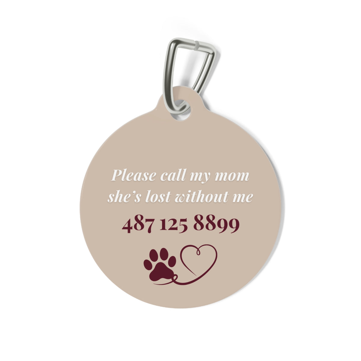 Back of the sand mountain pet tag with phone number and paw heart