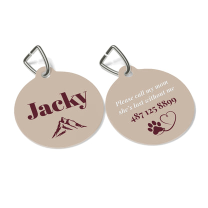 Front and back of the sand mountain personalized pet tag with engraved contact details