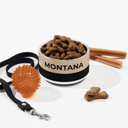 Tan and black two-tone personalized dog bowl with kibble, a leash, a ball and dog treats
