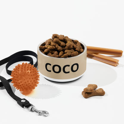 Tan modern personalized dog bowl with kibble, a leash, a ball and dog treats