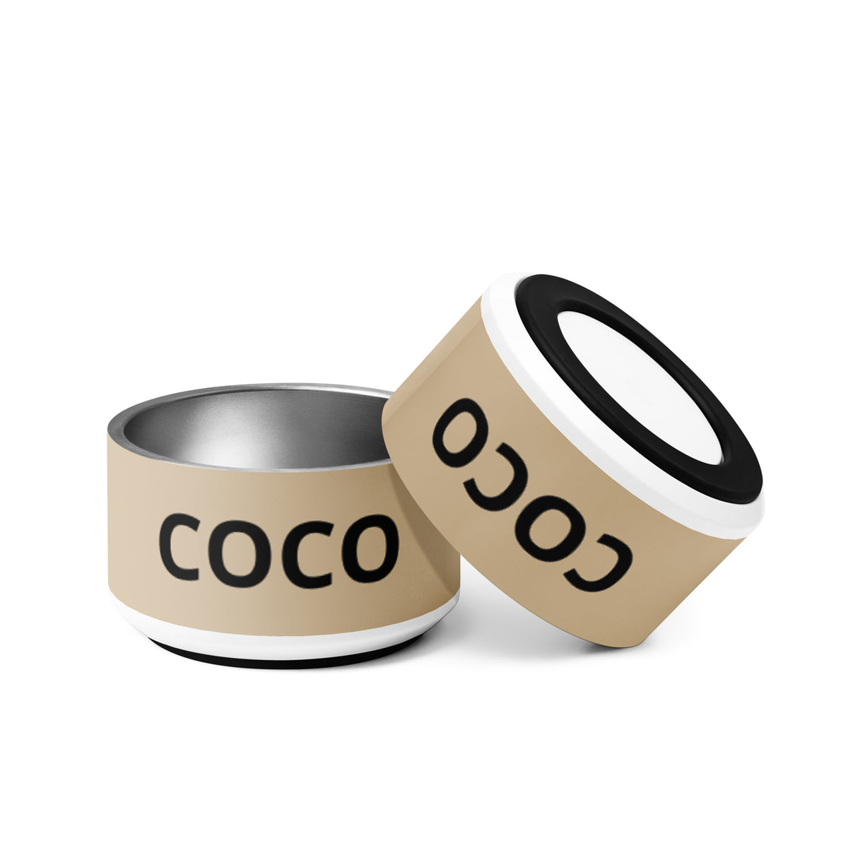 Two tan modern personalized dog bowls with the name Coco, one tilted to show the rim