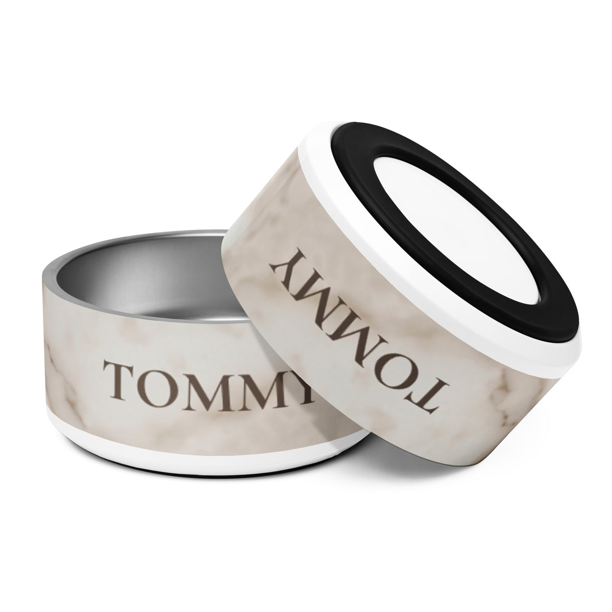 Two 32 oz white marble personalized dog bowls with the name Tommy, one tilted to show the non-slip base