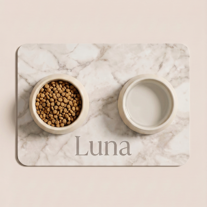 White marble personalized pet food mat with the name Luna holding a food bowl and a water bowl